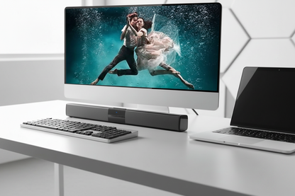 Barre de son PC  sur bureau moderne avec écran danseurs