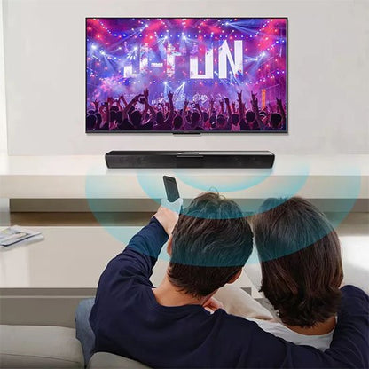 Barre de son PC sous la télévision avec couple qui regarde