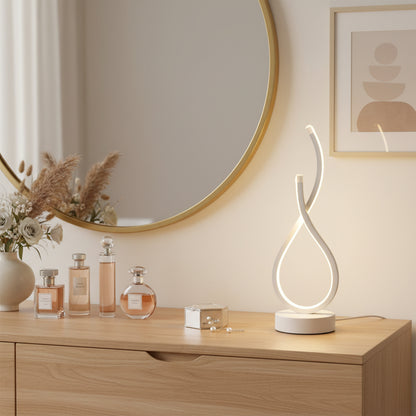 Lampe de bureau compacte sclupturale sur bureau parfumerie 