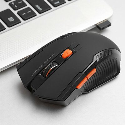 Souris sans fil  avec bouton orange sur bureau - Mon Univers Tecno